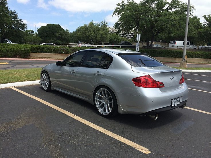 a silver car parked in a parking lot