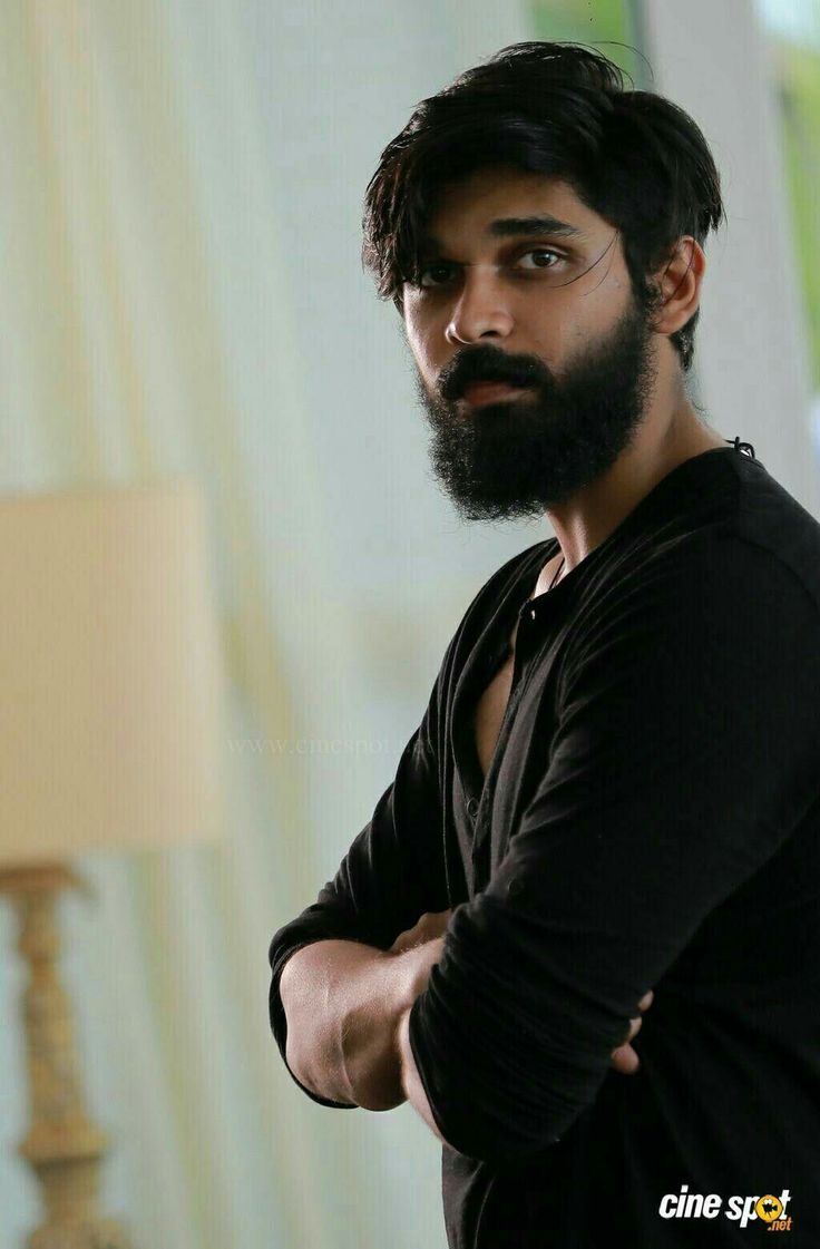 a man with a beard and black shirt