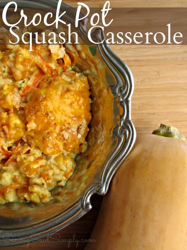 a close up of a casserole in a bowl on a table with a squash