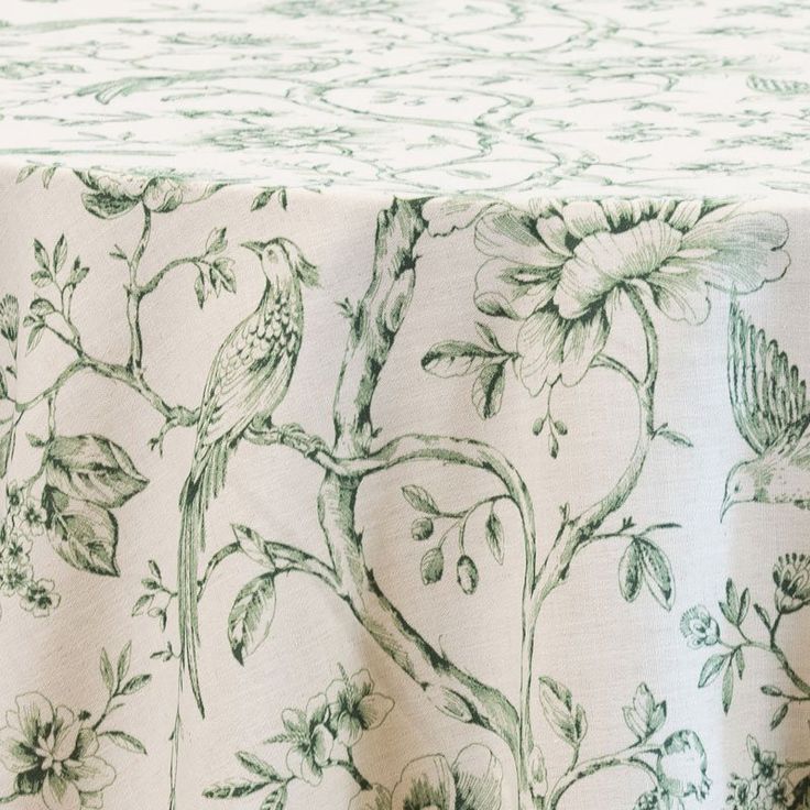 a table cloth with flowers and birds on it