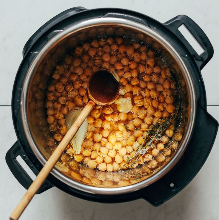 a pot filled with cooked beans and spices