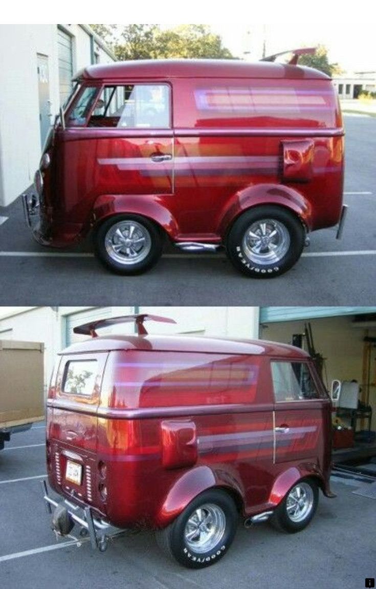 an old red van parked in a parking lot next to another vehicle with the door open