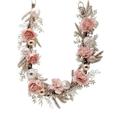 a necklace with flowers and pearls hanging from it's sides on a white background