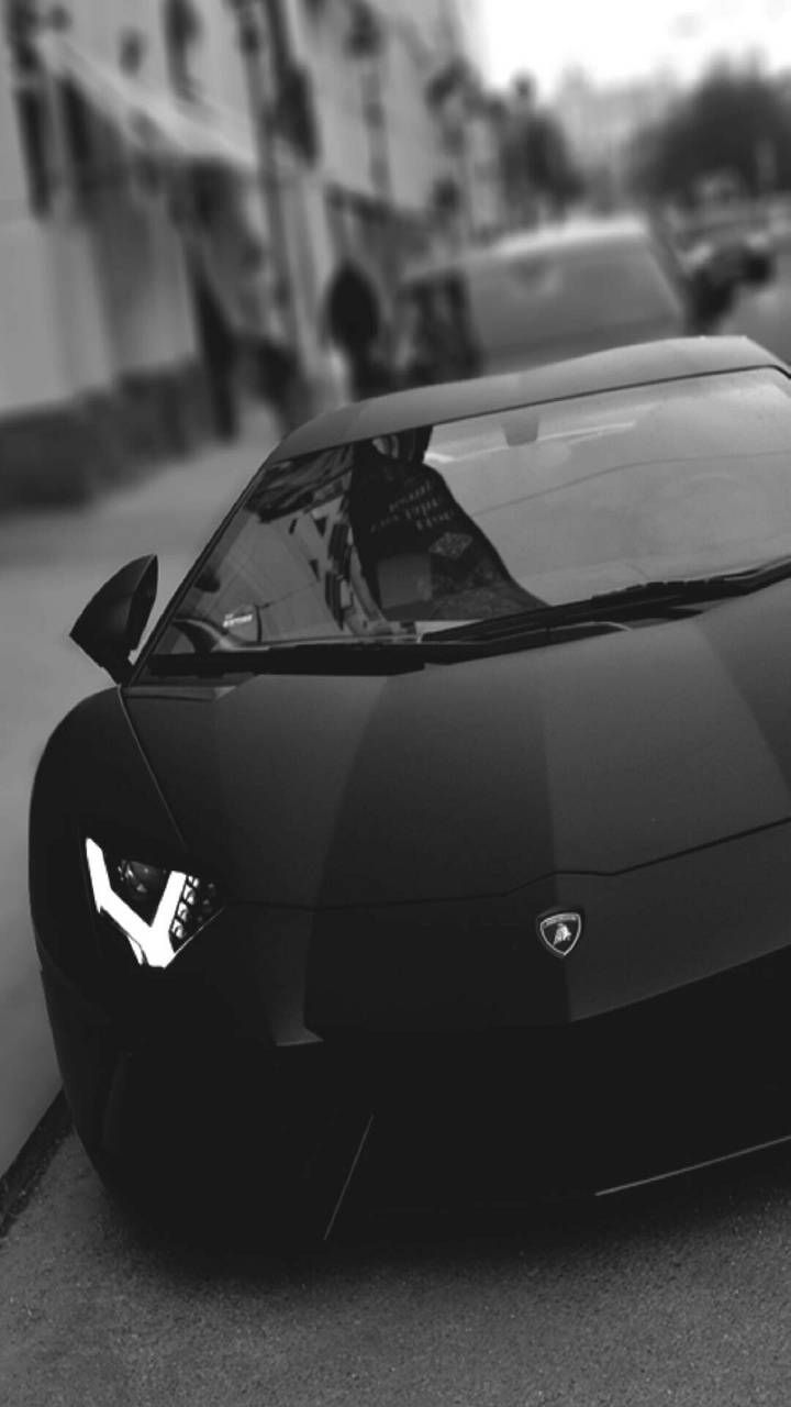 a black and white photo of a sports car