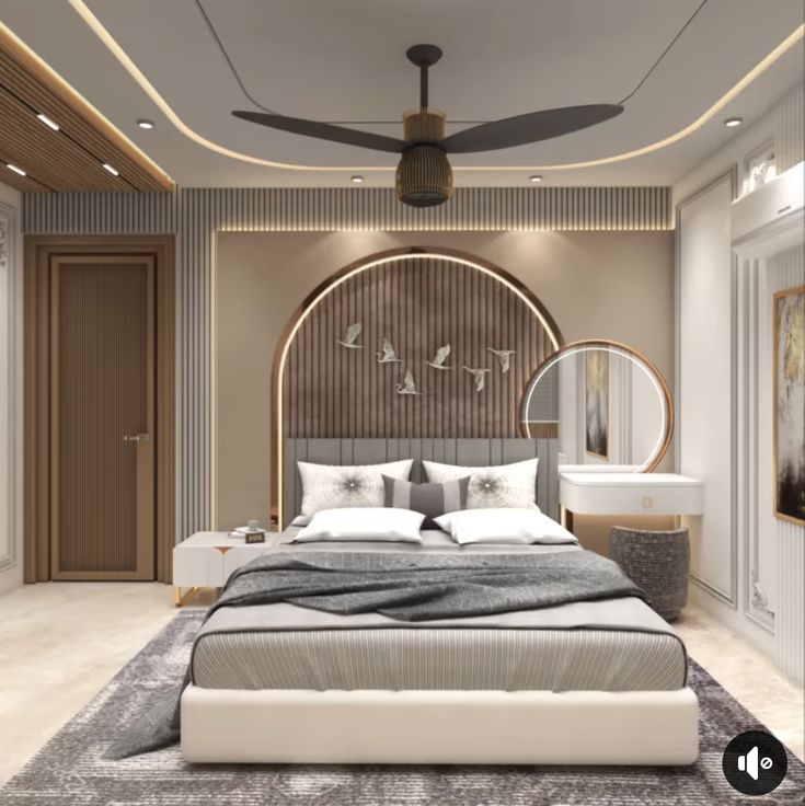 a large bed sitting under a ceiling fan in a bedroom