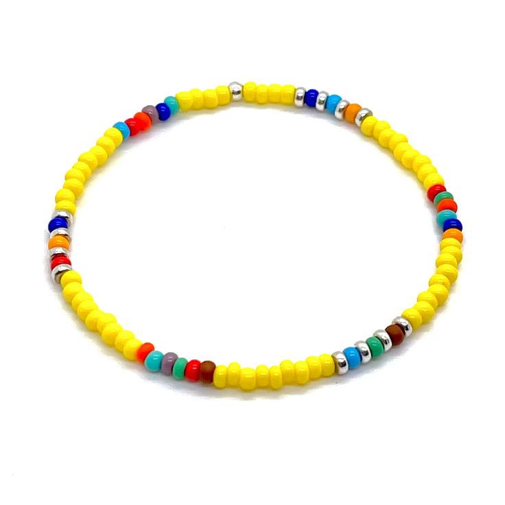 Men's summer bracelet with yellow beads and bright accent beads in assorted colors. Simple stretch bracelet. Adjustable Silver Beads Bracelets For Summer, Multicolor Tiny Beads Bracelets For Beach Season, Multicolor Tiny Beads Bracelet For Beach Season, Casual Yellow Beads For Beach, Multicolor Round Beads Friendship Bracelets For Beach Season, Multicolor Round Bead Friendship Bracelets For Beach Season, Multicolor Friendship Bracelets With Round Beads For Beach Season, Multicolor Beaded Bracelets For Beach Season, Adjustable Polished Bead Bracelets For Beach