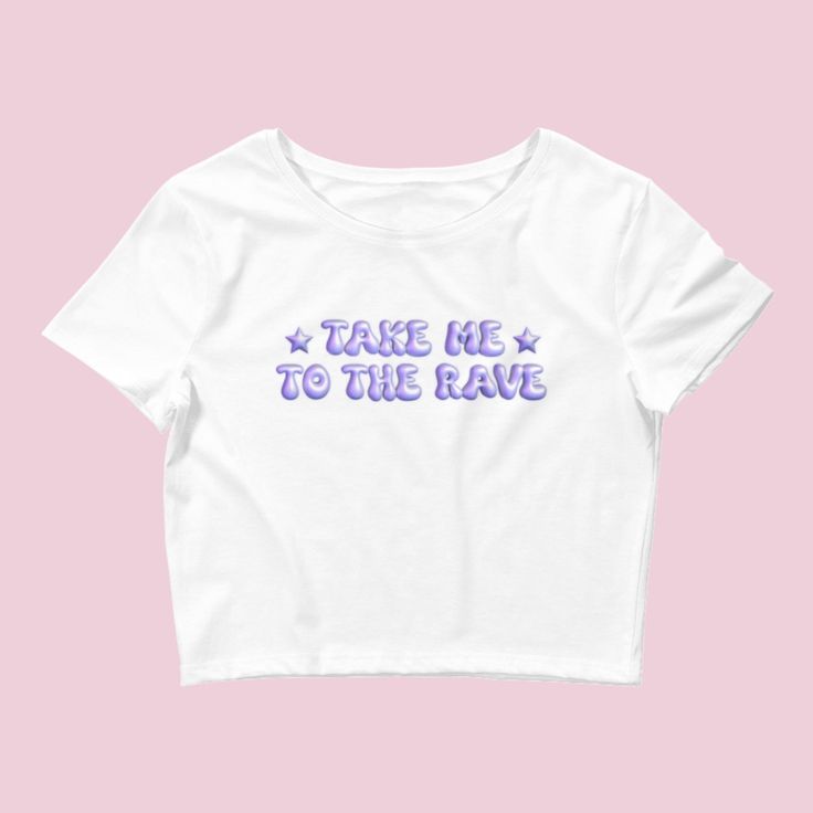 Introducing our "Take Me to the Rave" Y2K Rave Baby Tee – a stylish and comfy addition to your wardrobe, perfect for all the electronic music enthusiasts and festival-goers. This crop top is designed to capture the essence of the Y2K rave culture and the excitement of electronic music festivals. Embrace the rave vibes with this trendy baby tee. The "Take Me to the Rave" design signifies your passion for electronic music and the electrifying atmosphere of music festivals, making it an ideal choic Hip Hop Style T-shirt For Summer Music Festival, Y2k Graphic Print Tops For Music Festival, Trendy Screen Print Top For Music Festival, Trendy Graphic Design Tops For Concert, Cotton Y2k Tops For Music Festival, Graphic Tee Tops With Graphic Design For Music Festival, Trendy Graphic Print Tops For Music Festival, Trendy Crew Neck Tops For Music Festival, White Graphic Design Top For Music Festival