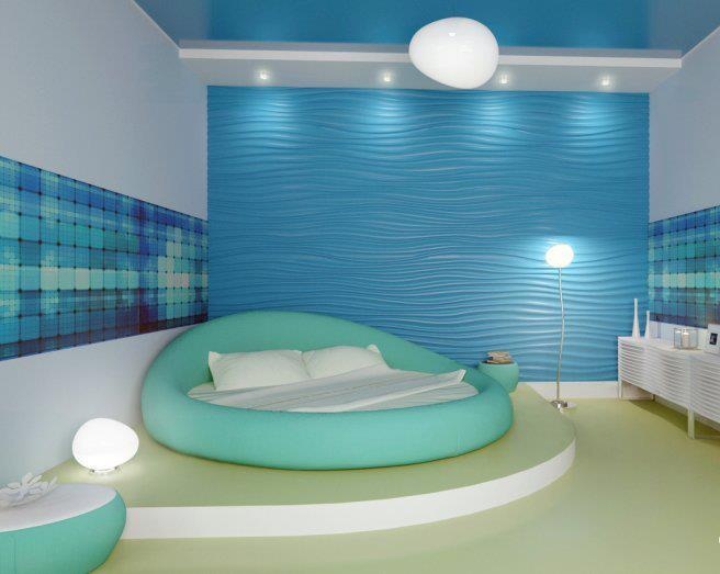 a bed sitting in the middle of a room next to a wall with blue tiles on it