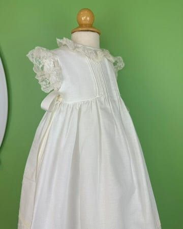 Made in Spain Dry Clean 50% Cotton, 50% Polyester Final sale, no exchanges nor returns are available White First Communion Dress With Pleated Bodice, White Pleated Bodice Dress For First Communion, White Sleeveless Gown With Lace Trim, Classic Dresses With Fitted Bodice For First Communion, Elegant Dresses With Pleated Bodice For Dress-up, Elegant Dresses With Pleated Bodice For Formal Occasions, White Sleeveless First Communion Dress With Ruffles, White Lace Trim Dress For Dress-up Occasions, White Lace Trim Dress For Dress-up