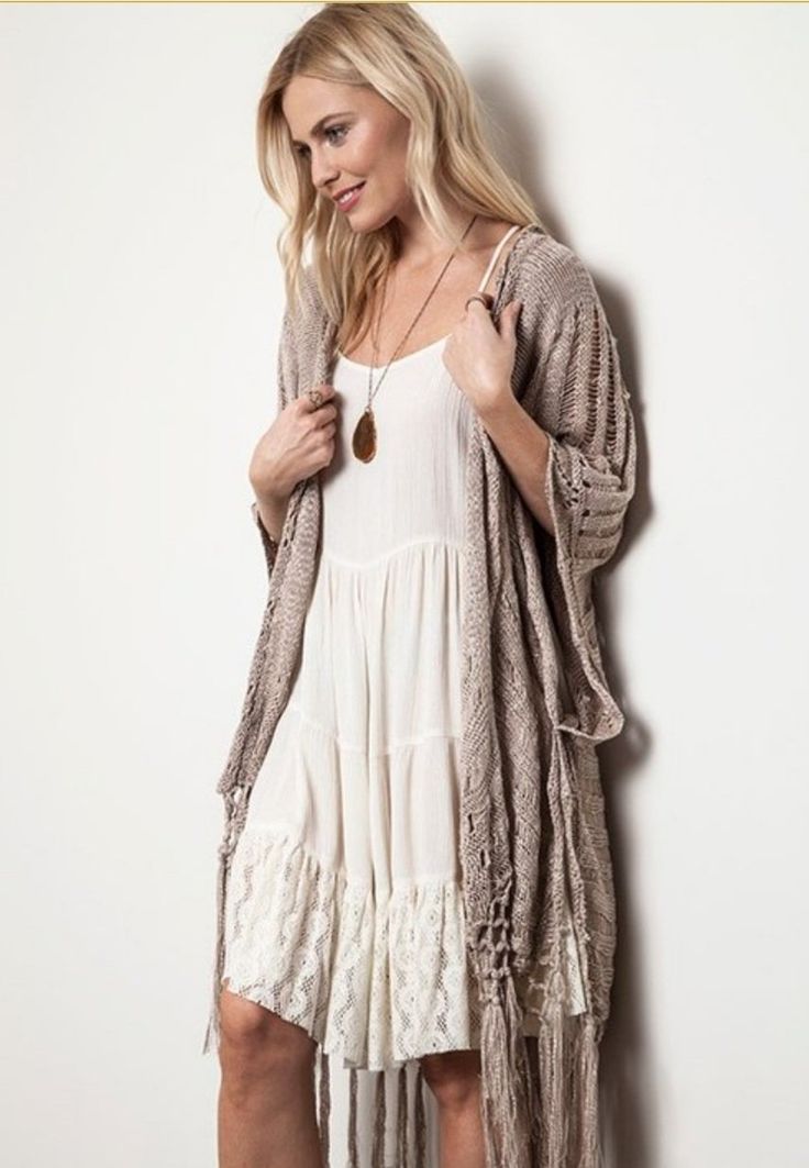 Boho Beautiful...turn any outfit into a boho masterpiece with this taupe crochet knit open poncho. Hangs beautifully with a bit of sheen to the knit. Simply stylish and stunning! 55% cotton 45% polyester S/M M/L Oversized Bohemian Fall Cover-up, Bohemian Beige Long Sleeve Cover-up, Bohemian Flowy Cover-up For Fall, Flowy Bohemian Cover-up For Fall, Bohemian Flowy Fall Cover-up, Flowy Bohemian Fall Cover-up, Bohemian Knit Poncho, Bohemian One Size Cover-up For Layering, Bohemian One-size Cover-up For Layering