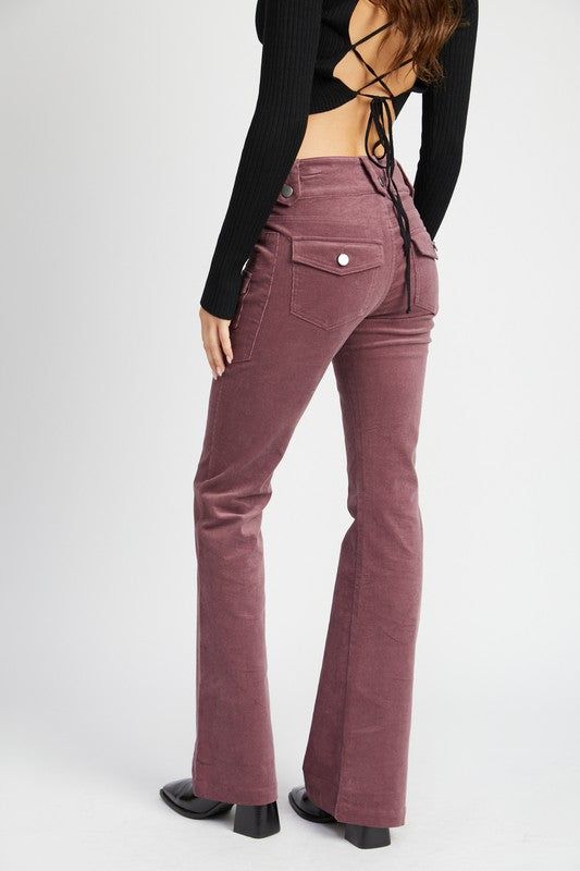 These corduroy pants bring a throwback to the late ’60s and early ’70s when low-rise silhouettes and earthy tones became the uniform for those embracing the bohemian revolution. The button details, perfectly positioned, nod to a utilitarian style that was popular during that time, blending functionality with flair. The subtle flare at the hem mirrors the bell-bottom craze of the ’70s, but with a modernized fit that hugs the hips and thighs before opening out at the calf, giving the leg a sleek, Pants Silhouette, Printed Linen Pants, You Look Fab, Boho Whimsical, Tie Dye Pants, Low Rise Pants, Utilitarian Style, Color Pants, Midi Denim