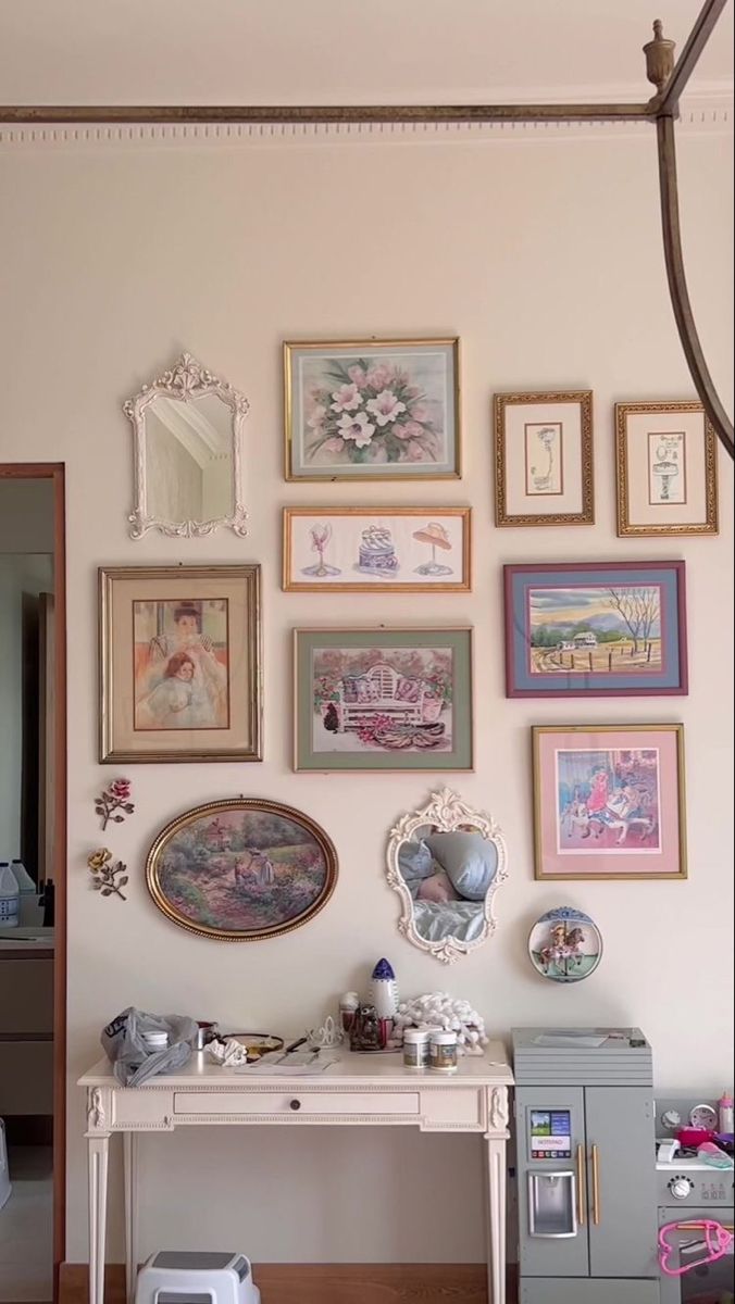 there are many framed pictures on the wall