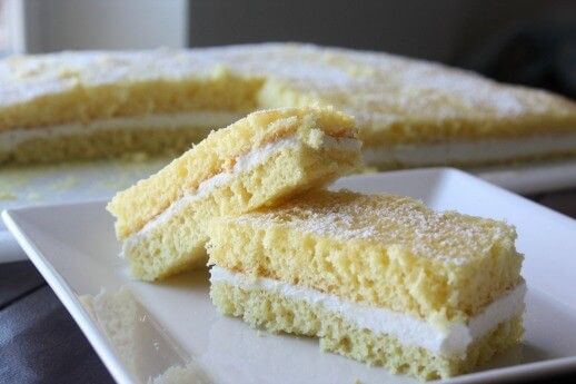 two pieces of cake sitting on top of a white plate next to another piece of cake