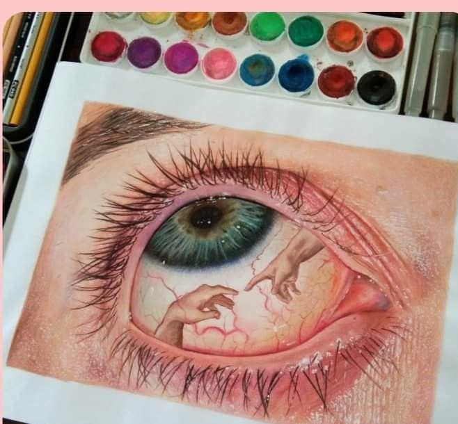 a drawing of an eye with colored pencils and watercolor paints next to it