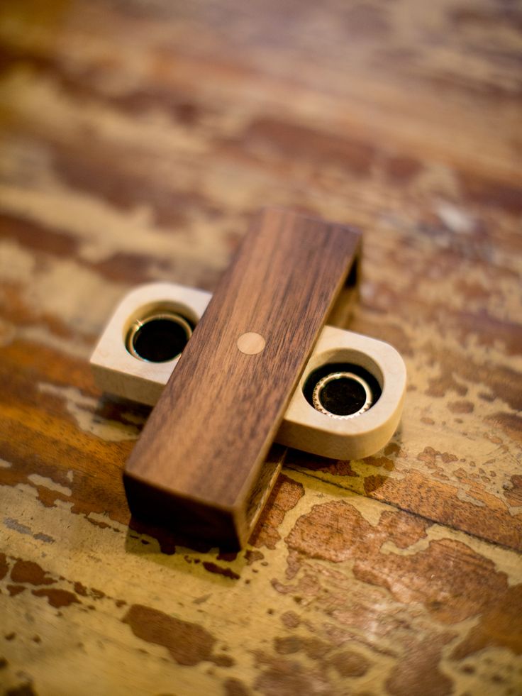 a pair of wooden speakers sitting on top of a table