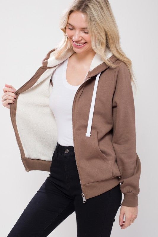 Featuring: Sherpa Lining/ Long sleeve/ Zip-up Front.Model is wearing a size Medium. Model Specs: Height: 5'8" / Bust: 34C / Waist: 24" / Hips: 34" Fabric Contents: 60% Cotton, 40% Polyester Cozy Cotton Fleece Jacket For Winter, Khaki Cotton Fleece Jacket With Pockets, Winter Cotton Hoodie Outerwear, Khaki Cotton Hooded Jacket With Long Sleeves, Warm Cozy Fit Cotton Outerwear, Casual Khaki Outerwear With Fleece Lining, Warm Cozy Cotton Outerwear, Hooded Khaki Fleece Jacket With Fleece Lining, Hooded Khaki Fleece Jacket With Lining