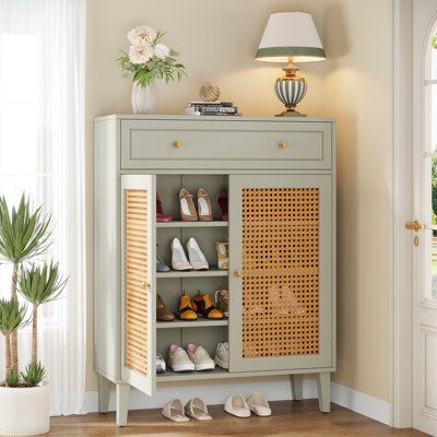 This shoe storage cabinet can bring a light color to your entryway, which color differs from others. When you come home change your shoes, the light green color can relax your mood from tired. The shelves inside can be adjusted according to the height of shoes, which means your boots can be stored too. Besides, the depth of the shoe cabinet is 15.74 inches, so the men’s shoes can also be accommodate at the same time. The drawer it has can accommodate some scattered stuff, such as keys, wallet, a Keys And Wallet Storage Entryway, Shoes Storage Cabinet, Show Rack Design, Shoe Armoire, Shoe Cabinet Entryway Modern, Shoes Cabinet Design, Foyer Shoe Cabinet, Entryway Furniture Ideas, Hall Cabinets