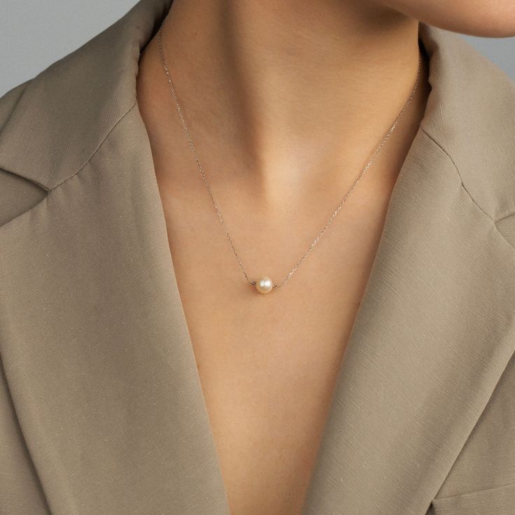 "Delicately dainty and elegant, this 14k gold solitaire pearl necklace is simple, yet sophisticated. A classic pearl floating on the 14k real gold chain will be your favorite piece of jewelry to wear every day.  F E A T U R E S    * Gold Carat: 14K  * Choice of Gold Color: Yellow Gold, Rose Gold, White Gold  * Pendant Diameter: 7,50 mm /  0.30 in * Length Options: 14\", 16\", 18\", 20\"   * Ready to Ship in 1-3 Business Days  * 1-Year Warranty  * Free Shipping  * Free returns within 30 days from Classic Sterling Silver Pearl Necklace For Everyday, Elegant Everyday Akoya Pearl Necklace, Elegant Everyday White Gold Pearl Necklace, Elegant Everyday Solitaire Necklace With Clavicle Chain, Elegant 14k Gold Pearl Drop Necklace, Dainty White Gold Pearl Drop Necklace, Formal 14k Gold Pearl Necklace With Pearl Charm, Dainty Rose Gold Pearl Necklace For Formal Occasions, Delicate White Gold Pearl Drop Necklace