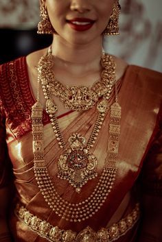 a woman wearing a gold and red outfit