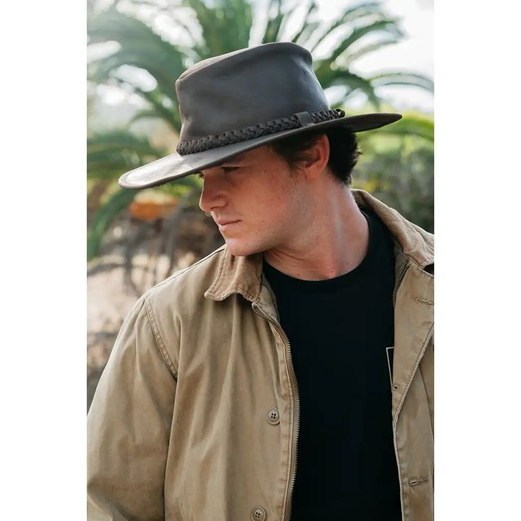 100% Genuine Leather Braided Leather Band Brim Size: 3" One Size Fits Most Unisex Style Introducing the Peter Grimm Hognose - Leather Outback Hat, a perfect blend of rugged style and practicality. This hat offers ample sun protection with its sturdy 3" brim, making it an ideal choice for those sunny days spent exploring the great outdoors or enjoying a day in town. Crafted from 100% genuine leather, the Hognose Hat exudes quality and durability, ensuring it will be a long-lasting addition to your wardrobe. The standout feature of this hat is the beautifully braided leather band that wraps around the crown, adding a touch of sophistication and a unique flair. This detail not only enhances the hat's classic appeal but also provides a stylish contrast that makes the hat truly pop. Whether you Leather Hats For Travel In Fall, Leather Ranch Hat With Flat Brim, Country Style Leather Hat With Flat Bill, Rugged Leather Hat Bands For Outdoor, Leather Travel Hat For Fall, Rustic Leather Hat Bands For Outdoor, Leather Fedora For Fall Travel, Leather Fedora For Travel In Fall, Fall Travel Leather Fedora