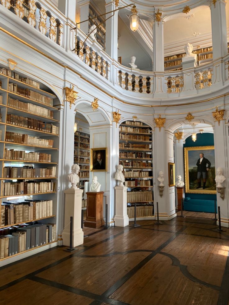 the inside of a large library with many bookshelves