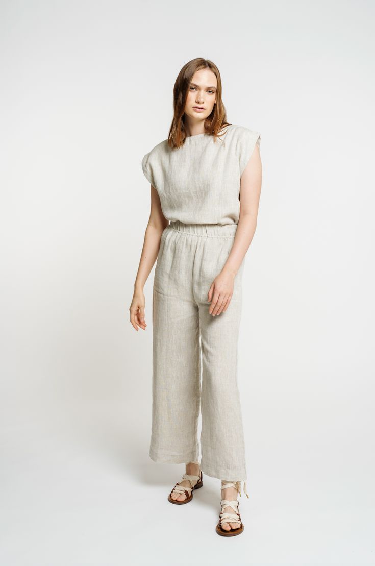 Our best-selling pant, complete with a high-waisted fit and cropped, wide-leg, back in customer favorite Natural. A cool, casual feel courtesy of our luxurious certified organic linen textile. The fully-elastic waistband offers comfort for all-day wear. Pair them with our Everyday Top for a powerful statement look or with any of our tops for a chic handmade ensemble. We appreciate the natural beauty of linen's undyed color and are excited to highlight it in our Natural colorway. Made with 100% O Flax Linen Wide Leg Ankle-length Pants, Elegant Linen Wide Leg Pants For Daywear, Relaxed Fit Linen Wide Leg Pants In Flax Color, Flax-colored Relaxed Fit Linen Wide Leg Pants, Relaxed Fit Flax Linen Wide Leg Pants, Beige Linen Wide Leg Pants For Daywear, Linen Wide Leg Straight Pants For Loungewear, Effortless Linen Pants With Elastic Waistband, Chic Flax-colored Relaxed Fit Wide Leg Pants