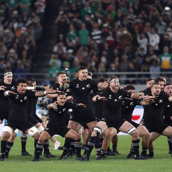 the new zealand rugby team is performing their haka at an international match in tokyo