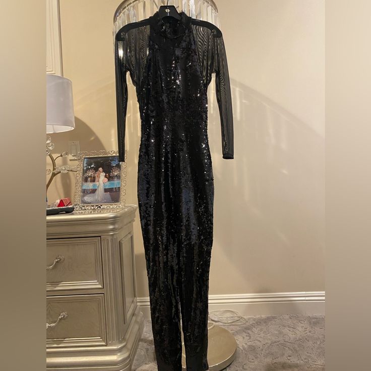 Saint Laurent Black Sequins Bodysuits. Originally Bought Sleeveless And Had Sheer Sleeves Put On For An Event. Has A Whole At The Seam Under One Arm, Can Be Sewn Back Easily. Worn Once Black Glamorous Evening Pantsuit, Fitted Evening Pantsuit For Party Season, Glamorous Black Evening Pantsuit, Glamorous Pantsuit For Parties, Fitted Pantsuit For Evening Party Season, Fitted Pantsuit For Evening And Party Season, Formal Fitted Sequin Pantsuit, Elegant Stretch Pantsuit For Parties, Fitted Sequin Pantsuit For Evening