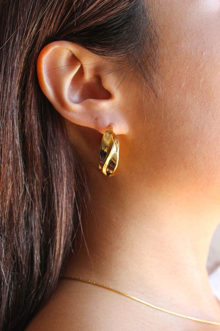 PRODUCT DESCRIPTION Get twisted in style with our Classic Twist Earrings. Featuring a sleek design with a modern twist, these earrings are perfect for both casual outings and special occasions. Gold Statement Earrings Water Resistant 18k-gold plated on High Quality Brass Size: 3.2cm x 2.9cm Read our full Jewellery Care Guide here Read our Sizing Guide here Modern Twist Everyday Earrings, Modern Twisted Earrings As A Gift, Modern Twist Polished Earrings For Formal Occasions, Gold Earrings With A Modern Twist, Modern Twist Round Earrings, Elegant Twisted Yellow Gold Earrings, Modern Twist Hoop Earrings For Anniversary, Formal Hoop Earrings With Modern Twist And Polished Finish, Modern Formal Hoop Earrings With Polished Finish