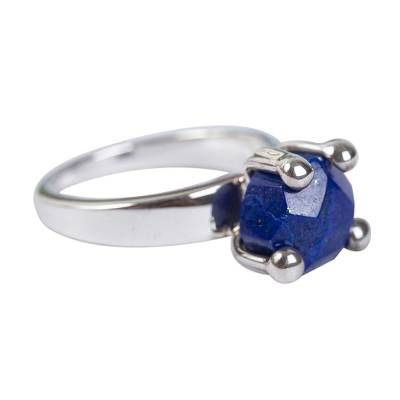 Four gleaming prongs clasp faceted lapis lazuli in this design by Guillermo Arregui. He works in Mexico's legendary sterling silver mined in Taxco to create a unique solitaire ring. Its color evokes the sea. Sapphire Lapis Lazuli Jewelry With Faceted Details, Classic Round Lapis Lazuli Jewelry, Formal Lapis Lazuli Ring Jewelry, Fine Jewelry With Lapis Lazuli Gemstone, Classic Lapis Lazuli Jewelry Ring, Sapphire Sterling Silver Jewelry With Round Stone, Sapphire Lapis Lazuli Ring Jewelry, Sapphire Lapis Lazuli Jewelry For Anniversary, Silver Lapis Lazuli Jewelry For Formal Events