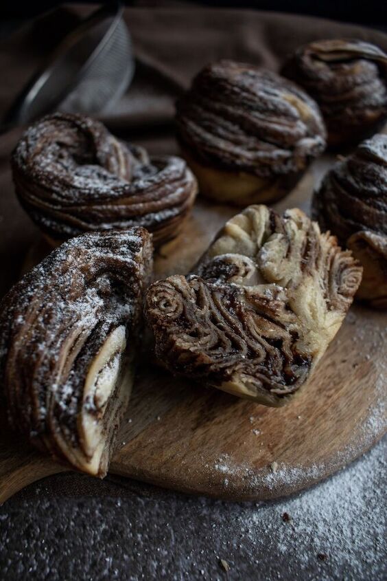 some pastries are sitting on a cutting board