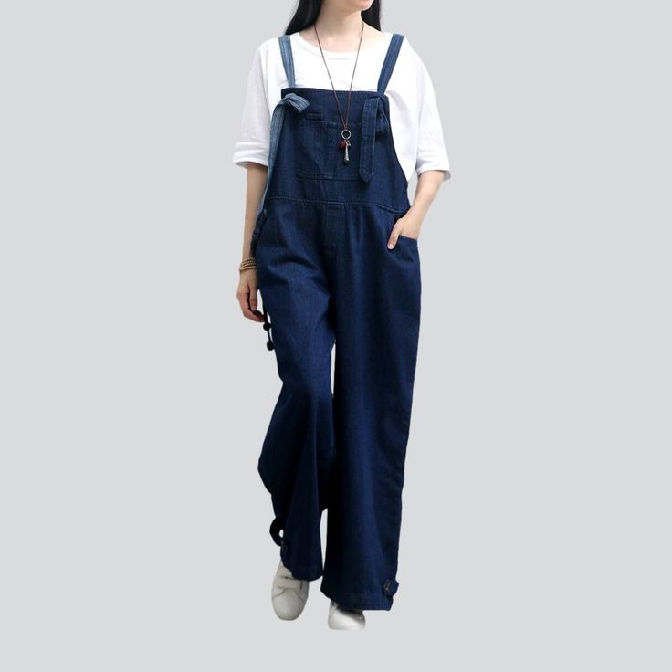 Be the trendsetter of the 2023 Autumn Collection with this stylish. loose & dark-wash women's denim jumpsuit! Perfect for a day out with friends. this Y2K-inspired look will make you the star of the show!Distinctive Features: Street Style: Look like you stepped out of the pages of a street style magazine with this jumpsuit. designed to keep you looking fashionable and chic. Dark Wash: The dark wash of this jumpsuit adds a touch of edginess. giving you an effortlessly cool vibe that will turn hea Womens Denim Jumpsuit, Street Style Magazine, Denim Dungaree, Jeans Street Style, Style Magazine, Jumpsuit Online, Autumn Collection, 2023 Autumn, Denim Overalls