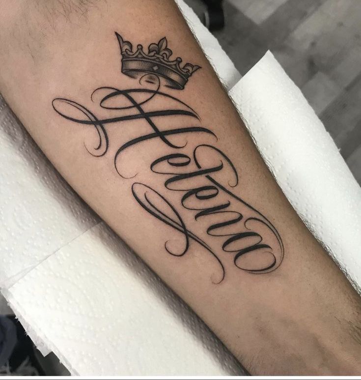 a tattoo with the word hello written in cursive writing and a crown on top