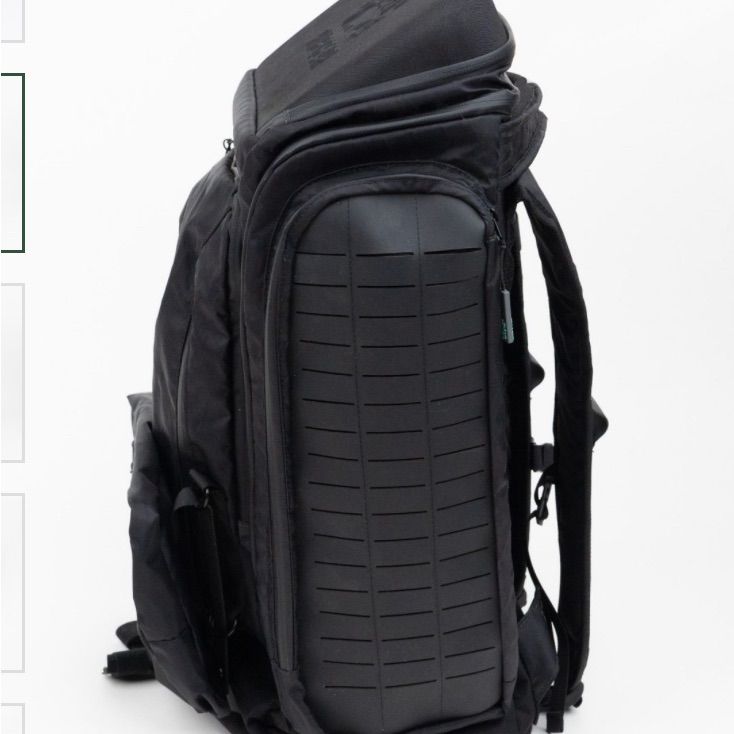 the back side of a black backpack with wheels on it and an additional zippered pocket