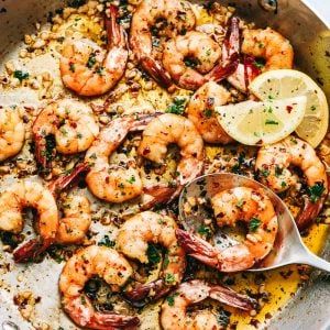 a skillet filled with shrimp and rice