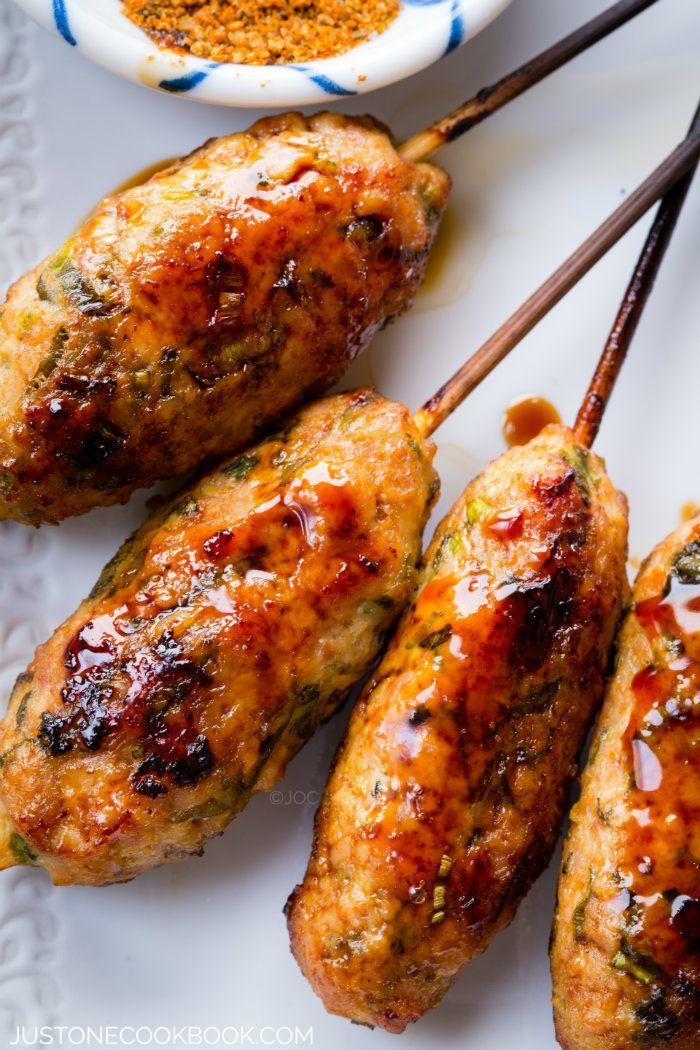 chicken skewers with dipping sauce on the side