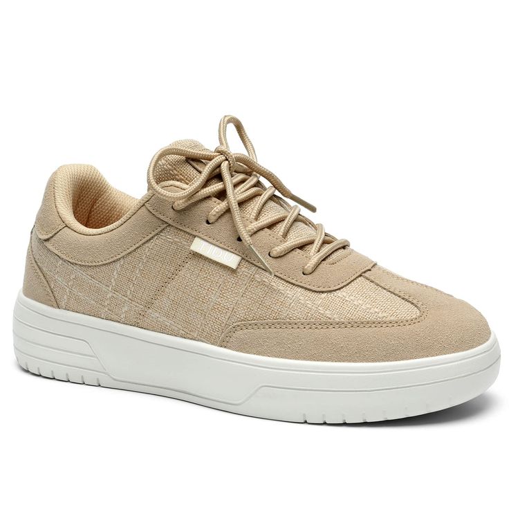 a beige sneaker with laces on the top