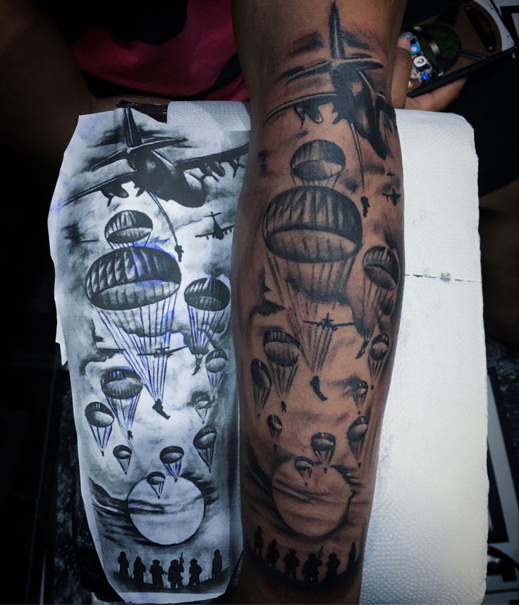 a man's arm with tattoos on it and an image of hot air balloons in the sky