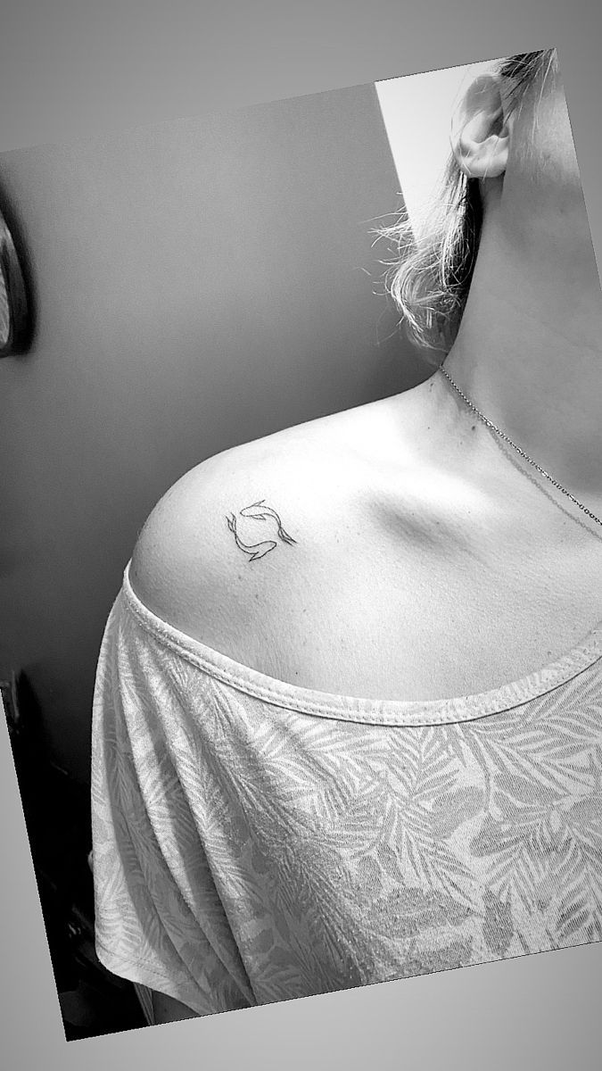 a woman with a small tattoo on her chest