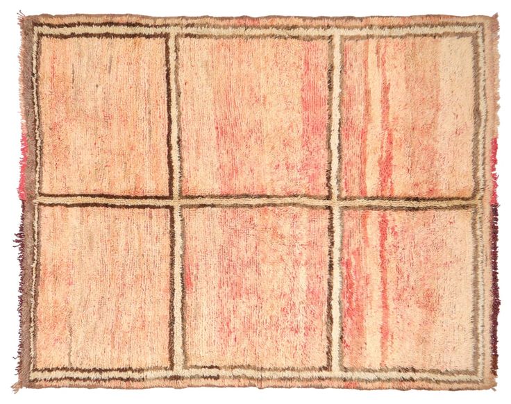 an old rug with squares and fringes on the bottom is shown in pink tones