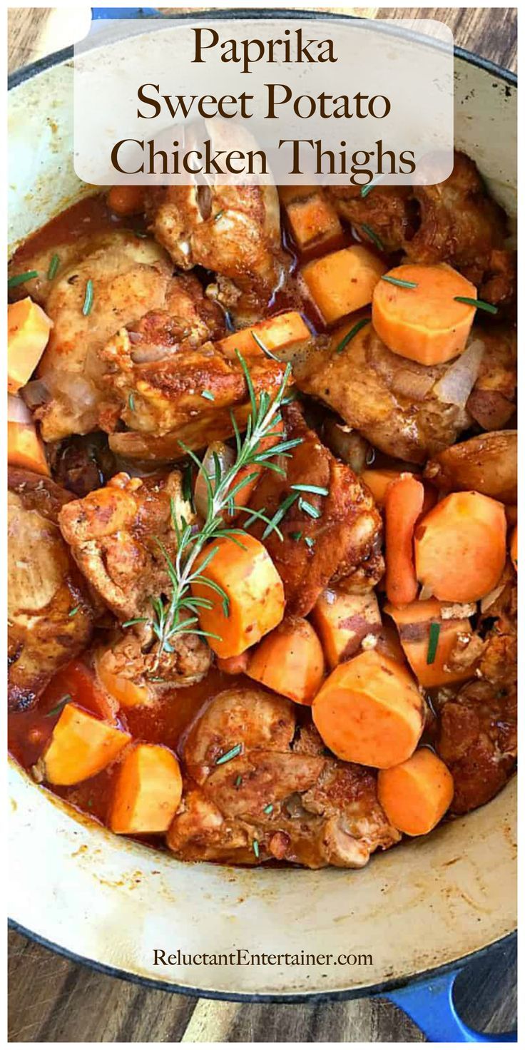 a pan filled with chicken thighs and carrots