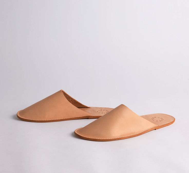 A simple, chic take on the classic house slipper. FROM THE MAKER: It’s so important to take care of your feet. We suggest you put them in these stylish house shoes in a slip on silhouette, made with a double layer vachetta sole and vegetable tanned leather upper. Sizing ﻿XS: 6-7 W, 36-37 Euro S: 8-9 W, 38-39 Euro M: 10-11 W, 8-9 M, 40-41 Euro Pointy Shoes, Electronic Gifts, Simple Chic, Leather Slippers, House Shoes, Classic House, House Slippers, Monogram Initials, Vegetable Tanned Leather