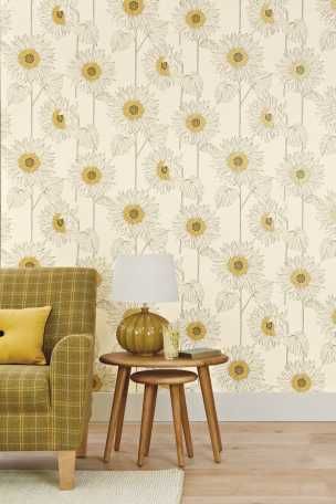 a living room with a chair, table and wallpaper on the walls that has sunflowers