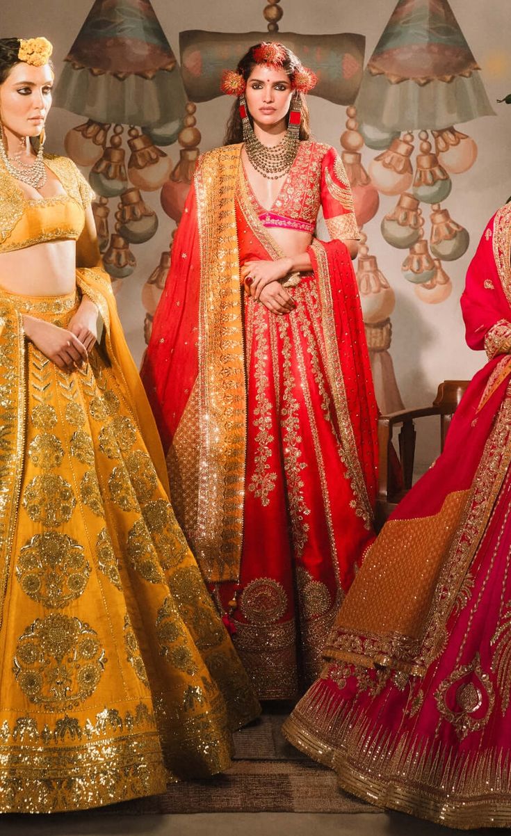 The rooh afza lehenga is a tribute to the bold and fearless traditional bride. Crafted in classic red raw silk, it features a stunning overlay of floral and chand-phool motifs in gold. Paired with a unique patchwork dupatta adorned with intricate jaal work on a vibrant sunshine orange backdrop, this lehenga exudes timeless elegance. Comes with a separate cancan for added volume and flair. Art Silk Dupatta With Tilla For Reception, Reception Art Silk Dupatta With Tilla Detail, Raw Silk Tilla Dupatta For Reception, Reception Raw Silk Dupatta With Tilla Detail, Red Tilla Saree For Reception, Banarasi Silk Lehenga With Sheer Dupatta For Reception, Red Tilla Lehenga For Navratri, Red Tilla Lehenga For Festive Occasion, Unstitched Tilla Lehenga For Wedding