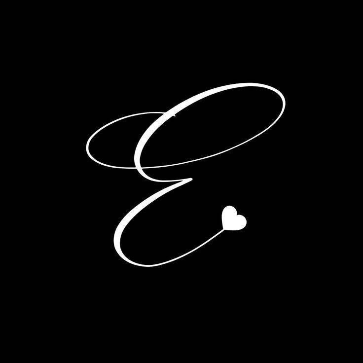 the letter g is inscribed in white on a black background with a heart at the bottom