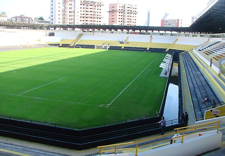 an empty soccer field in the middle of a city