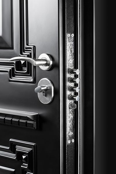 an open door with metal handles and knobs on the front, in black and white