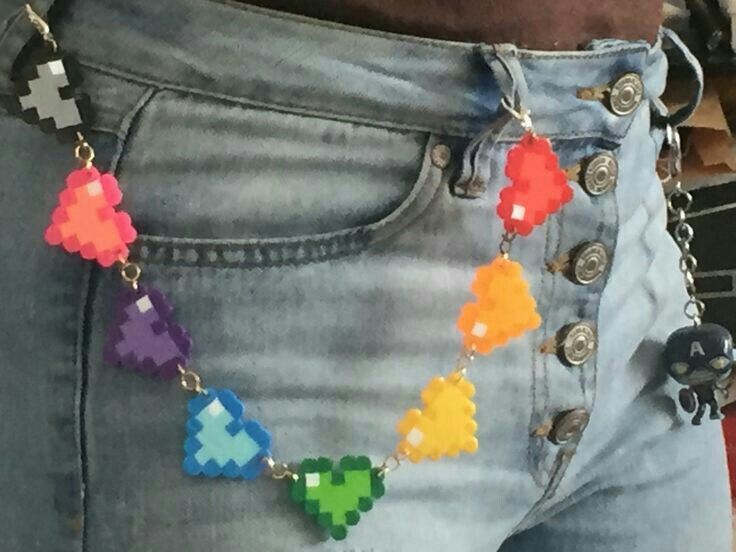 a pair of jeans with colorful beads attached to them