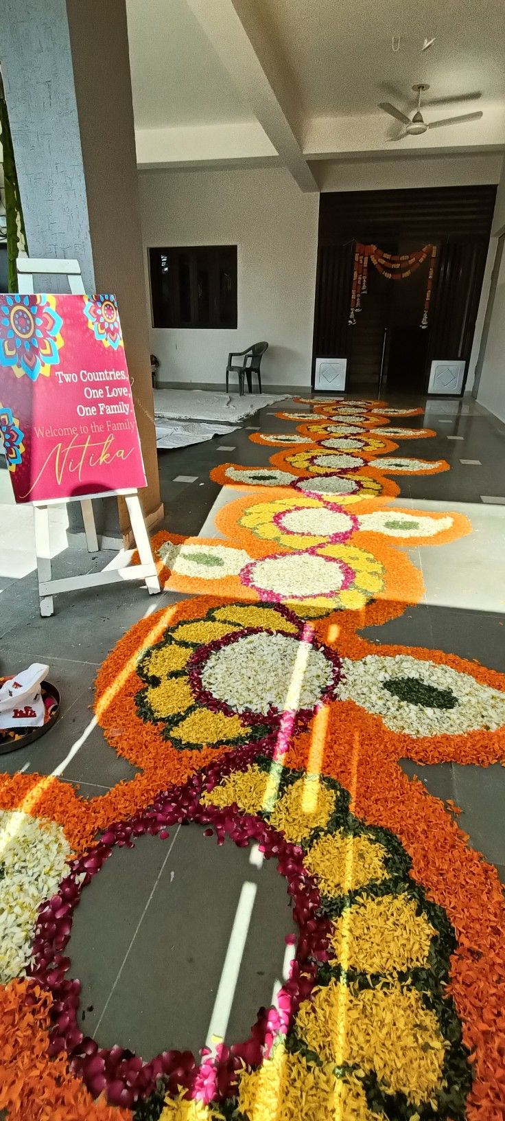 the floor is decorated with flowers and signs for people to sign in front of them