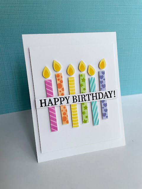 a birthday card with candles on it